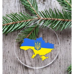 Изображение товара -  Патриотический новогодний шар прозрачный плоский “Карта Украины с гербом“ 10см